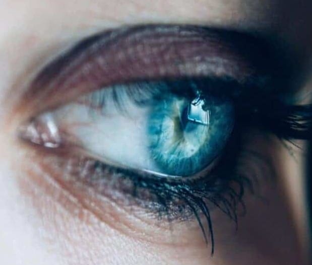 EMDR. A close-up picture of a women's blue eye gazing to the side during Eye Movement Desensitization and Reprocessing Therapy