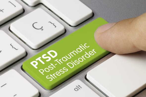 PTSD treatment in Dubai. The picture shows a computer keyboard. On one button the word. PTSD is engraved 